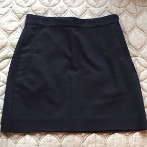Navy mini skirt by The Row.